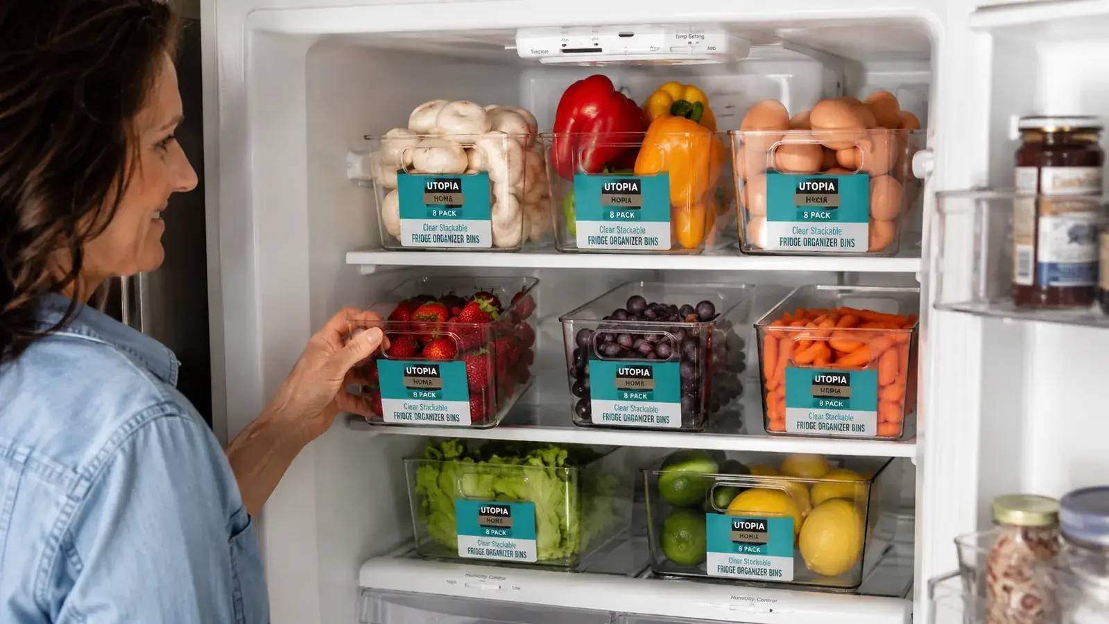 Open refrigerator showing all eight bins arranged by food zone across three shelves
